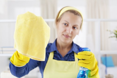 Cleaner preparing carpet cleaning equipment safely before use